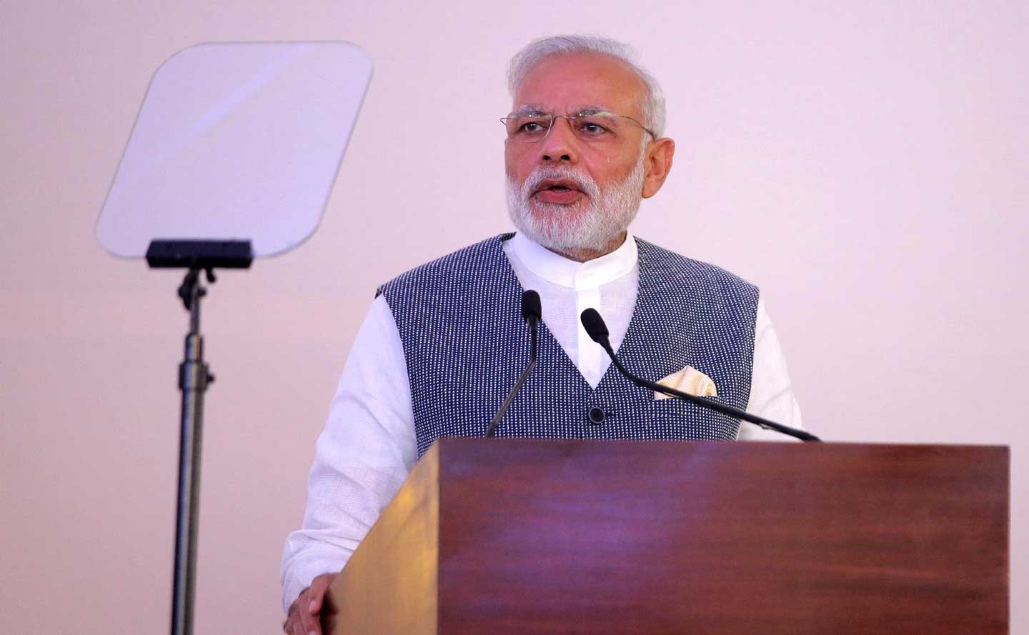 Indian Prime Minister Narendra Modi standing at a podium