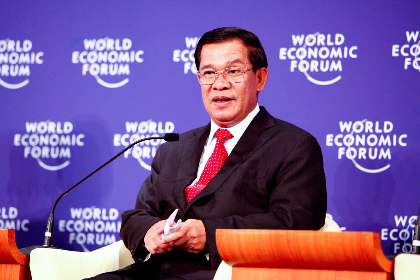 Cambodian Prime Minister Hun Sen sitting in a chair at the World Economic Forum