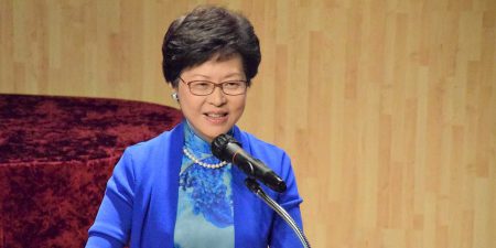 Hong Kong Chief Executive Carrie Lam speaking into a microphone