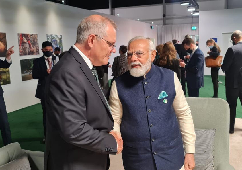 Narendra Modi shaking hands with Scott Morrison