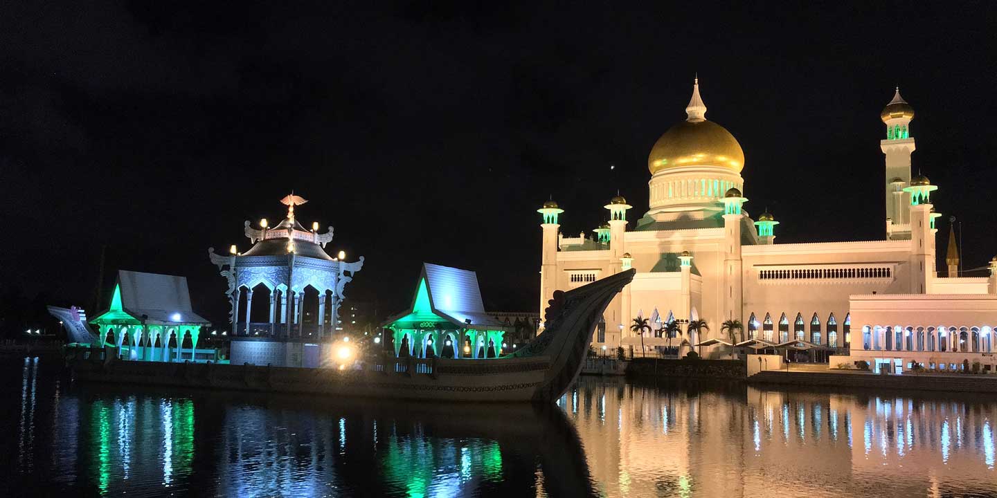 A boat in the water outside Sultan Omar Ali Saifuddin Mosque, Brunei
