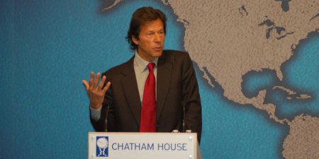 Imran Khan speaking at a podium