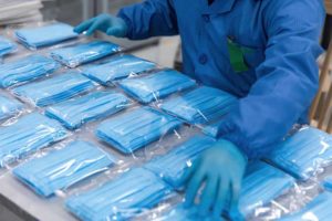 Medical masks in bags on a production line