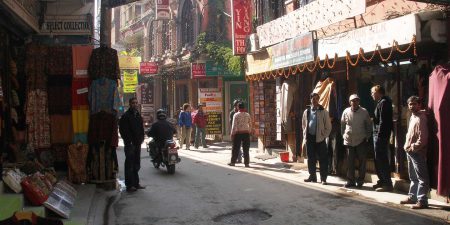 Persons standing outside of the tourist shops in Kathmandu, Nepal