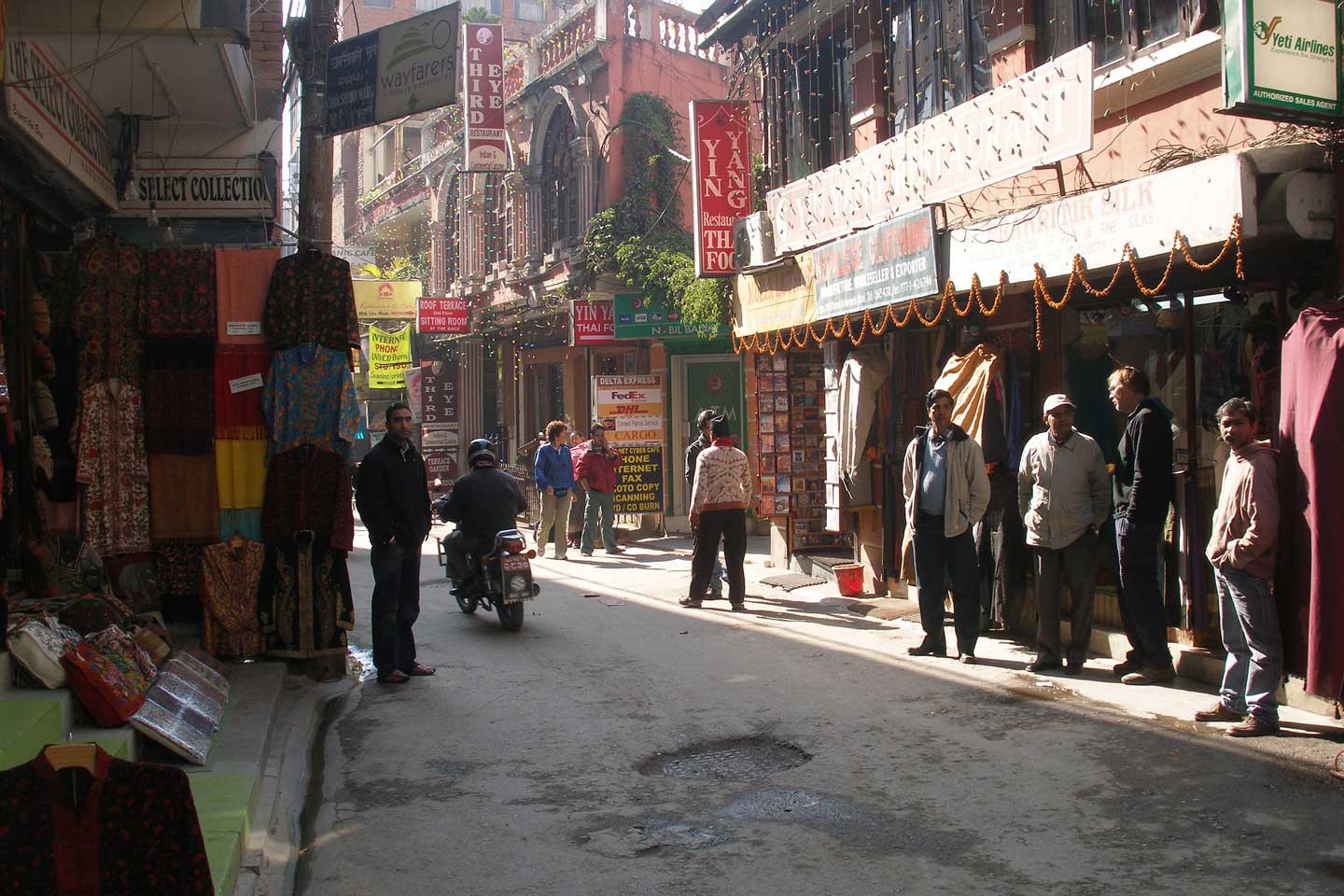 Persons standing outside of the tourist shops in Kathmandu, Nepal